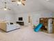 Large carpeted bonus room featuring a slide, TV, and access to another room or bathroom at 642 Bear Tree Creek, Chapel Hill, NC 27517