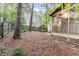 Large backyard with a privacy fence, mature trees, and access to the screened-in porch at 707 Cross Timbers Dr, Durham, NC 27713