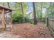 Spacious backyard with a wooden fence and access to the screened in porch, perfect for outdoor activities at 707 Cross Timbers Dr, Durham, NC 27713