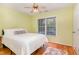 Bedroom features a ceiling fan, light colored walls, and a sunny window at 707 Cross Timbers Dr, Durham, NC 27713
