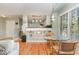 Cozy dining area featuring hardwood floors and natural light from a large window at 707 Cross Timbers Dr, Durham, NC 27713