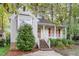 Beautiful home exterior with a cozy front porch, brick stairs, and vibrant landscaping at 707 Cross Timbers Dr, Durham, NC 27713