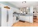 Well-lit kitchen featuring stainless steel appliances, tile backsplash, and white cabinetry at 707 Cross Timbers Dr, Durham, NC 27713