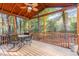 Enjoy outdoor dining on this screened porch with a wood ceiling, ceiling fan, and wooded views at 707 Cross Timbers Dr, Durham, NC 27713