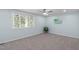 Bedroom featuring neutral carpeting with a ceiling fan and natural light at 7715 Bernadette Ln, Raleigh, NC 27615