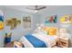 Bright bedroom featuring an eye-catching color palette, ceiling fan, and natural light at 7715 Bernadette Ln, Raleigh, NC 27615