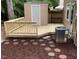 Back deck with storage building and a small amount of ground cover around the deck at 7715 Bernadette Ln, Raleigh, NC 27615