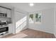 Charming dining area featuring natural light, modern fixtures, and ample space for entertaining at 7715 Bernadette Ln, Raleigh, NC 27615