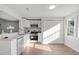 Well-lit kitchen with white cabinetry, stainless steel appliances, and a functional design at 7715 Bernadette Ln, Raleigh, NC 27615