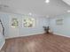 Cozy living room featuring wood floors, access to the backyard, and neutral walls at 7715 Bernadette Ln, Raleigh, NC 27615