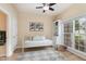 Bright bedroom with natural light and a daybed, features hardwood floors and a ceiling fan at 8 Queensland Ct, Durham, NC 27712