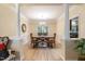 Bright dining room with hardwood floors and a wooden table and chairs, features white columns at 8 Queensland Ct, Durham, NC 27712