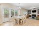 Dining room with lots of natural light from windows and glass paneled door, opens to living room at 8 Queensland Ct, Durham, NC 27712