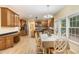 Kitchen and breakfast nook featuring oak cabinets and stainless steel appliances at 8 Queensland Ct, Durham, NC 27712