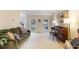Spacious living room with hardwood floors features a piano and lots of natural light at 8 Queensland Ct, Durham, NC 27712