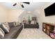 Comfortable living room with neutral tones, plush seating, and a wall-mounted television at 8 Queensland Ct, Durham, NC 27712