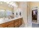 Well-lit main bathroom with a double sink vanity, soaking tub, and separate glass shower at 8 Queensland Ct, Durham, NC 27712