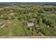 Sweeping aerial view of a countryside estate, complete with manicured lawns and mature trees at 9026 Privette Hill Ln, Spring Hope, NC 27882