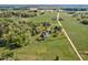 Sprawling aerial view of a charming estate, revealing the vastness of the land at 9026 Privette Hill Ln, Spring Hope, NC 27882