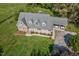 Elevated aerial shot showcases a gorgeous home with an attached garage at 9026 Privette Hill Ln, Spring Hope, NC 27882