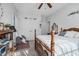 Bedroom with a hardwood frame bed, white accents, and gray carpeting at 9026 Privette Hill Ln, Spring Hope, NC 27882