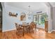 Charming dining room featuring hardwood floors, a window with a view, and ample natural light at 9026 Privette Hill Ln, Spring Hope, NC 27882