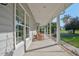 Inviting front porch with rocking chairs, offering a relaxing outdoor space with lovely views at 9026 Privette Hill Ln, Spring Hope, NC 27882