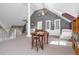 Inviting living room featuring a game table, neutral walls, and vaulted ceilings at 9026 Privette Hill Ln, Spring Hope, NC 27882