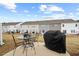 Spacious backyard featuring a patio with a table and grill, great for entertaining at 95 Little Leaf Lane Ln, Clayton, NC 27527