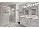 Modern bathroom features a double sink vanity, tiled shower, and updated fixtures at 95 Little Leaf Lane Ln, Clayton, NC 27527