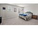 Bright bedroom with carpet, neutral walls, and two windows at 95 Little Leaf Lane Ln, Clayton, NC 27527