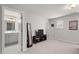 Bright bedroom features neutral walls, carpet, and a view to the bathroom at 95 Little Leaf Lane Ln, Clayton, NC 27527