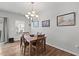 Dining room with hardwood floors, a modern chandelier, and natural light at 95 Little Leaf Lane Ln, Clayton, NC 27527