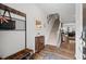 Entryway with wood-look flooring, coat rack, shoe storage, mirror and stairway at 95 Little Leaf Lane Ln, Clayton, NC 27527