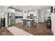 Bright, open kitchen features white cabinets, stainless steel appliances, quartz countertops, and center island at 95 Little Leaf Lane Ln, Clayton, NC 27527
