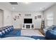 Cozy living room with a fireplace, a plush rug, and lots of natural light at 95 Little Leaf Lane Ln, Clayton, NC 27527