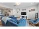 Bright living room featuring an open concept, a fireplace, and hardwood floors at 95 Little Leaf Lane Ln, Clayton, NC 27527