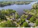 Stunning aerial view of waterfront homes nestled among lush greenery on a picturesque lake at 955 Sagamore Dr, Louisburg, NC 27549
