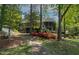 Beautiful backyard with stone path leading to a screened porch at 955 Sagamore Dr, Louisburg, NC 27549