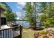 Enjoy the outdoors in this landscaped backyard with lake access and beautiful plantings at 955 Sagamore Dr, Louisburg, NC 27549