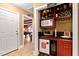 Entertaining bar area with wine storage, sink, microwave, and a mini fridge at 955 Sagamore Dr, Louisburg, NC 27549