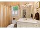 Bathroom featuring a vanity, toilet, and window with natural lighting at 955 Sagamore Dr, Louisburg, NC 27549