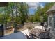 Enjoy the view of the lake from this rear deck and outdoor dining area at 955 Sagamore Dr, Louisburg, NC 27549
