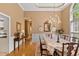 Well-lit dining room showcasing hardwood floors and a charming chandelier, perfect for Gathering gatherings at 955 Sagamore Dr, Louisburg, NC 27549