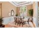 Elegant dining room featuring a large window, chandelier, and decorative details for a refined atmosphere at 955 Sagamore Dr, Louisburg, NC 27549