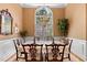 Bright and airy dining room with a large arched window, chandelier, and neutral decor at 955 Sagamore Dr, Louisburg, NC 27549