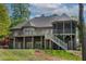 Spacious brick home featuring a multi-level deck and screened porch at 955 Sagamore Dr, Louisburg, NC 27549