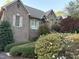 Beautiful brick home with mature landscaping, bushes and flowering trees at 955 Sagamore Dr, Louisburg, NC 27549