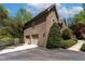 Spacious three-car garage attached to a beautiful brick home near the lake at 955 Sagamore Dr, Louisburg, NC 27549