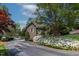 Beautiful brick home with a well-maintained yard and blooming flowers near waterfront at 955 Sagamore Dr, Louisburg, NC 27549